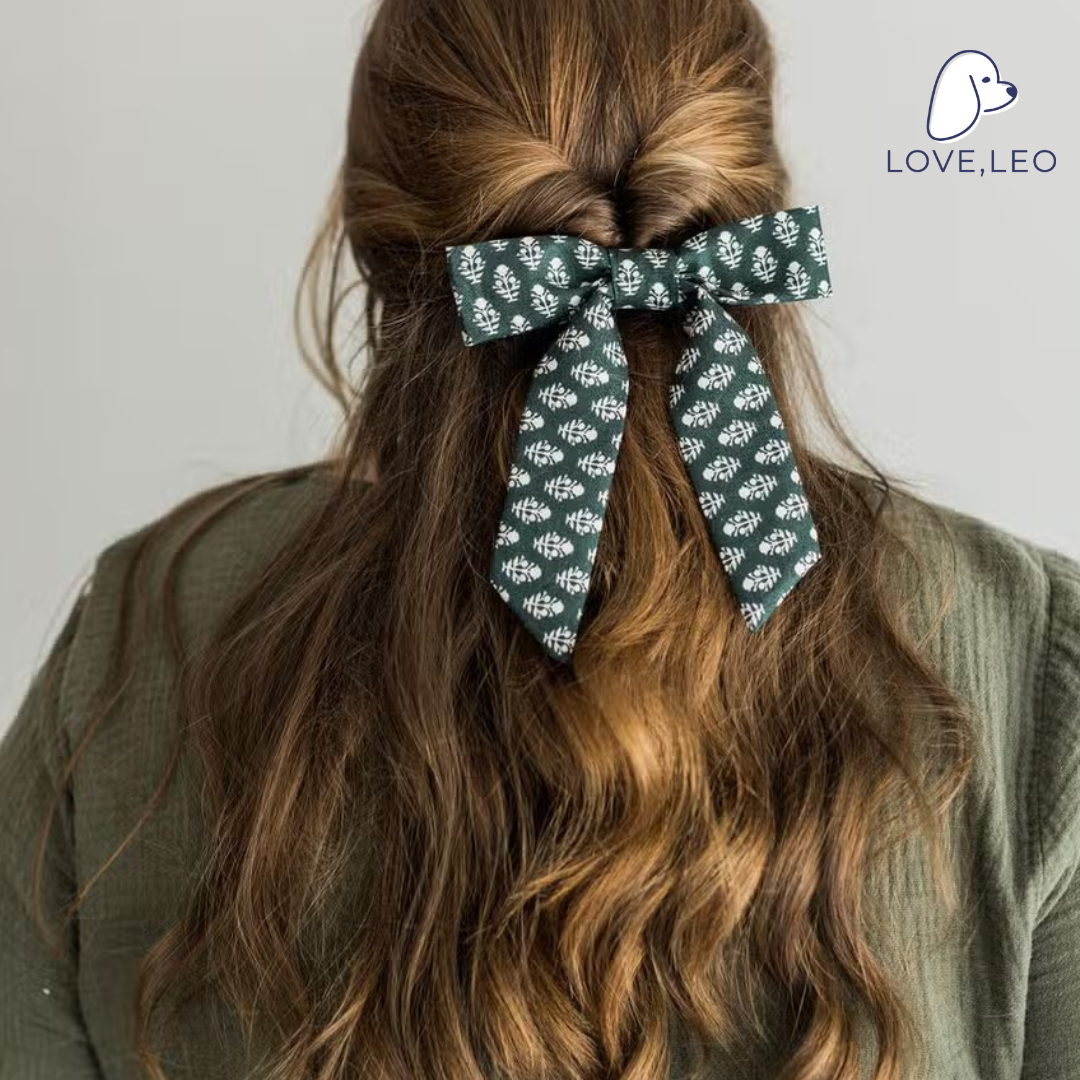 Luxe fabric hair bows are the perfect hair accessory for women and children. The Emily bow is attached to a 3" (80mm) French barrette. Dimensions The Emily bow measures roughly 5.25" wide by 6.25" long. * Luxe Fabric * Seasonal Bows * French Barrette