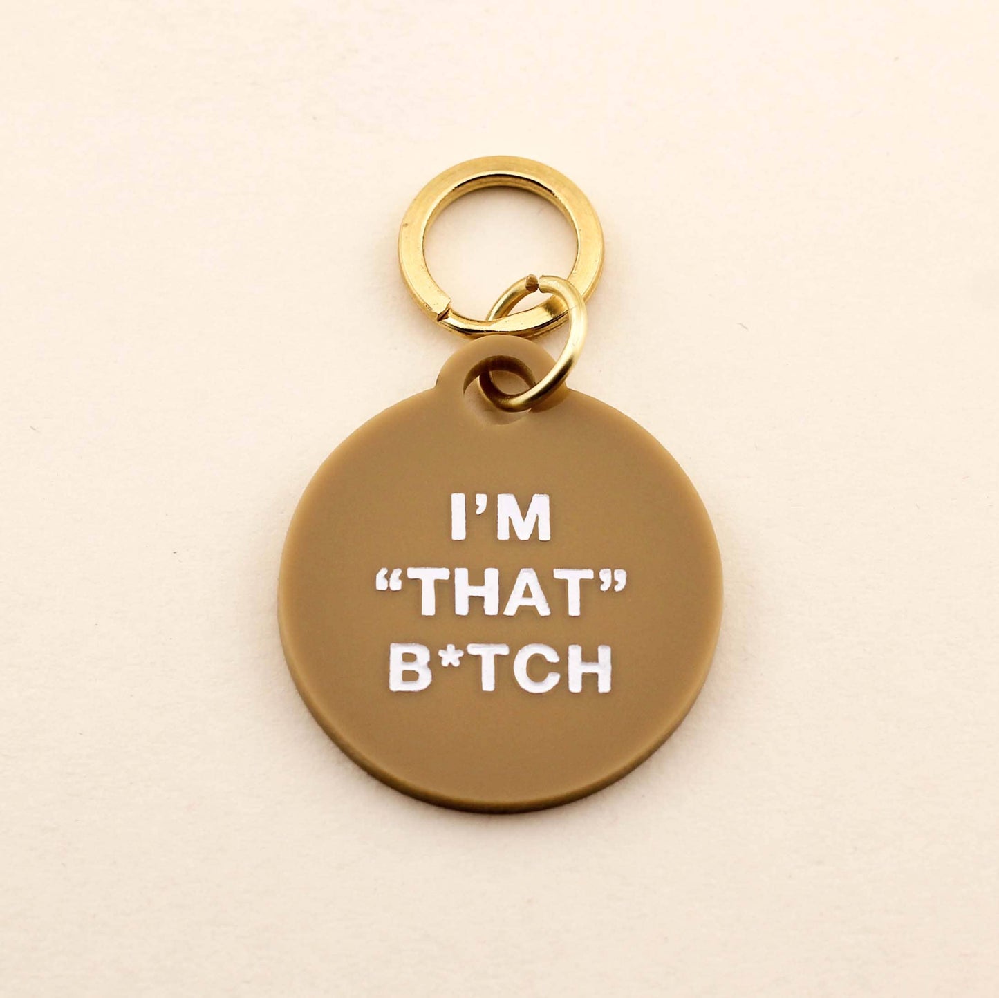 Our I'm "That" B*tch Pet Tag comes in our high-quality Tan Acrylic! Pet tags are sold individually Size: 1.25" L by 1.4" H Made of high-quality acrylic with color-fill Handcrafted in Augusta, Georgia
