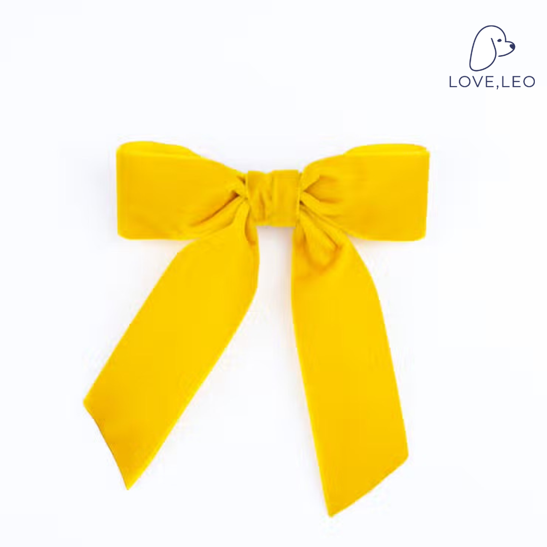 Lovely Delora bow is a velvet hair bow for women or children. This bow features beautiful short ribbon tails. The most perfect bow for little ladies and grown ups alike!! Dimensions The Delora Bow measures approximately 5" wide and tails are approximated 6" long from top of bow to longest tip. This bow is secured on a 3" French barrette. * Luxe Velvet Ribbon * Classic Bow * French Barrette