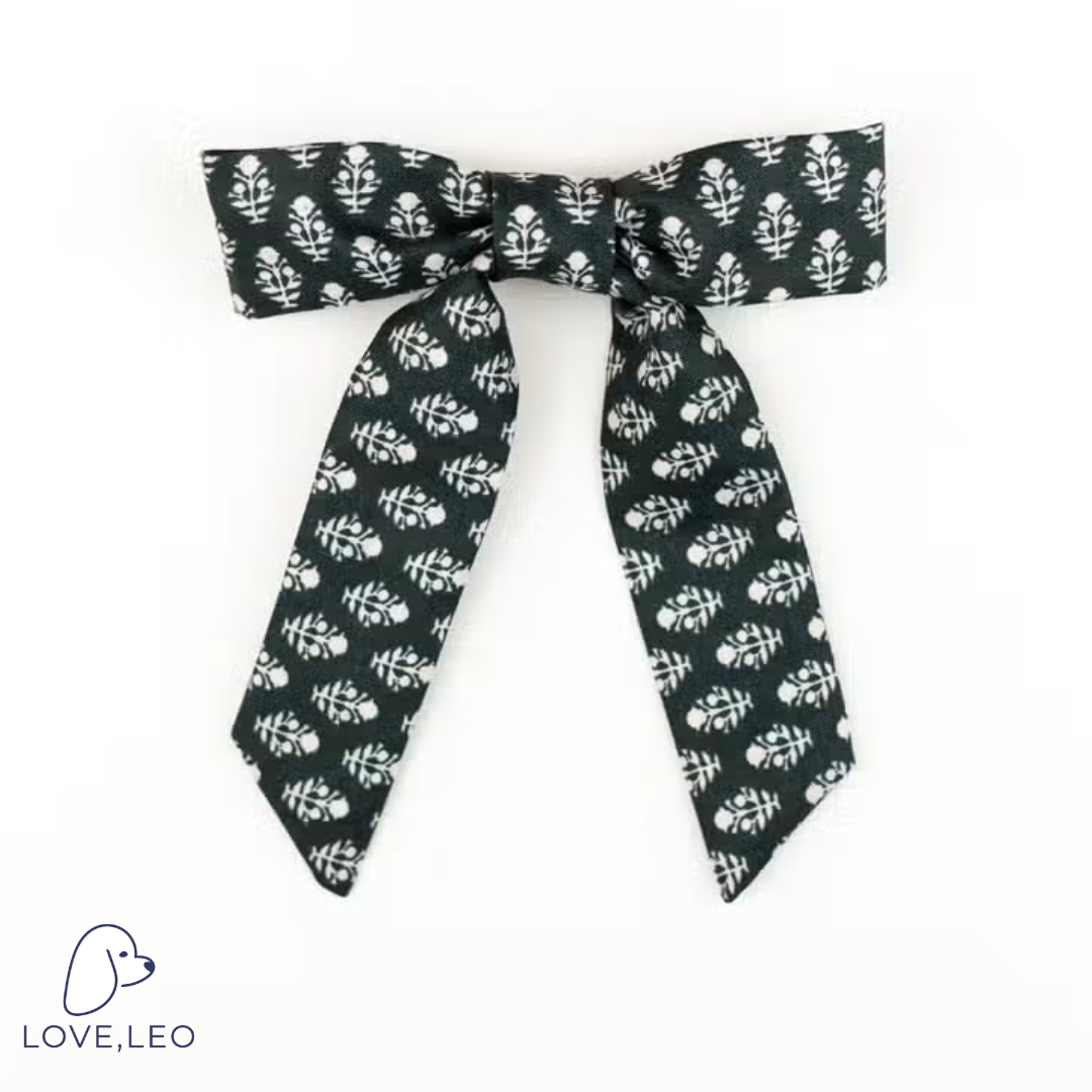Luxe fabric hair bows are the perfect hair accessory for women and children. The Emily bow is attached to a 3" (80mm) French barrette. Dimensions The Emily bow measures roughly 5.25" wide by 6.25" long. * Luxe Fabric * Seasonal Bows * French Barrette