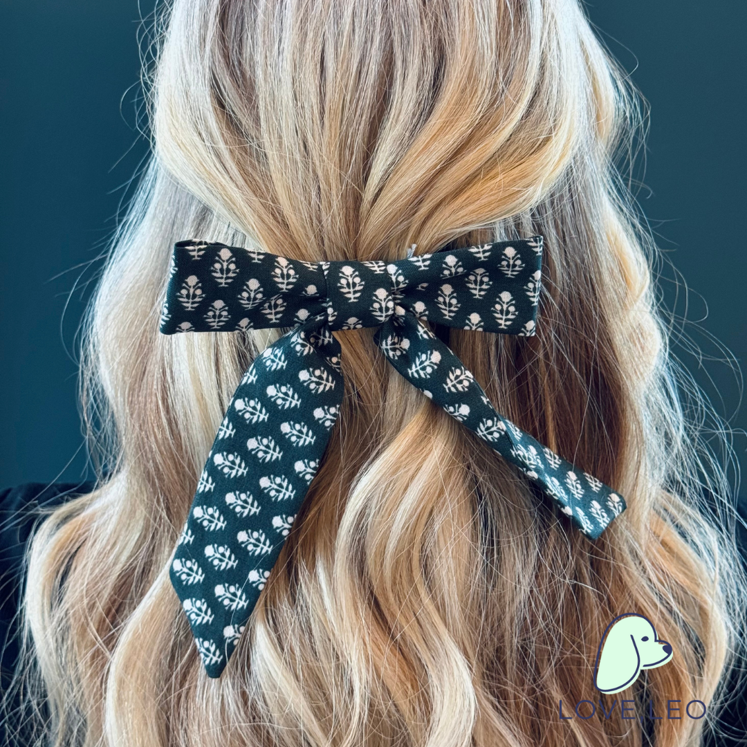 Luxe fabric hair bows are the perfect hair accessory for women and children. The Emily bow is attached to a 3" (80mm) French barrette. Dimensions The Emily bow measures roughly 5.25" wide by 6.25" long. * Luxe Fabric * Seasonal Bows * French Barrette