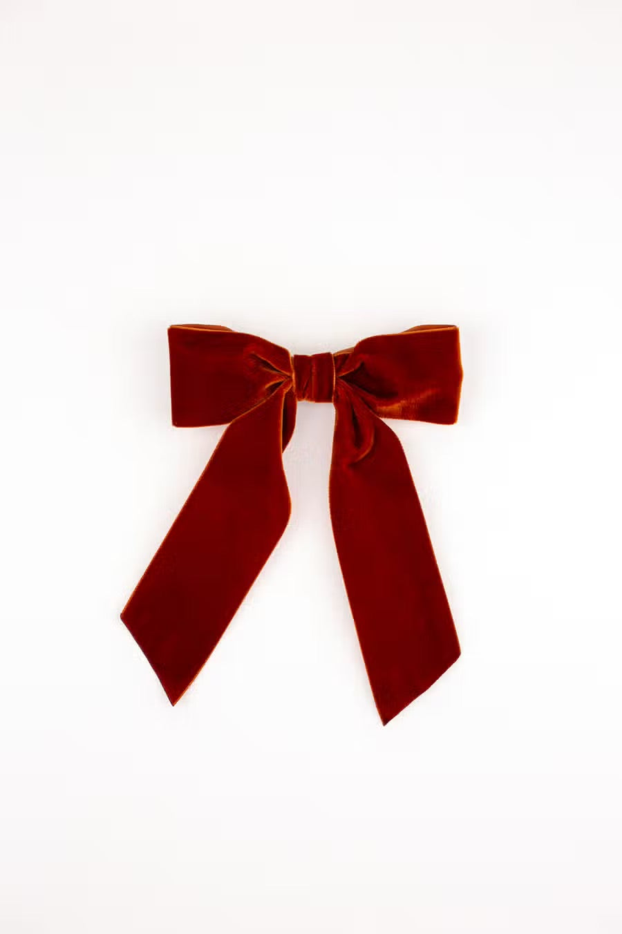 Luxe velvet hair bows are the perfect hair accessory for women and children. The Bailee Bow is a signature bow featuring beautiful ribbon tails. Each bow is made with soft, luxurious velvet ribbon! Dimensions The Bailee Bow measures approximately 5.5" wide and tails are approximated 7.5” long from top of bow to longest tip. This bow is secured on a 3" French barrette. * Luxe Velvet Ribbon * Signature Hair Bow * French Barrette