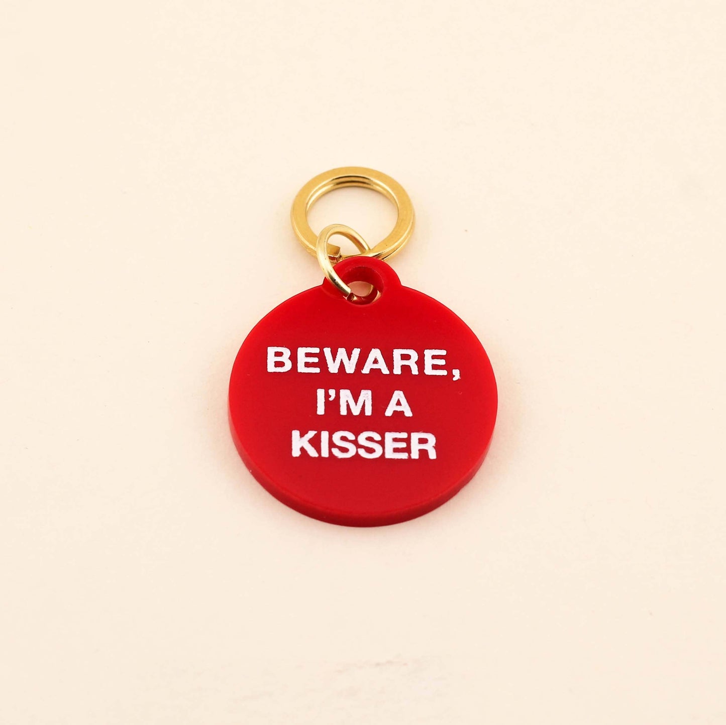 Designed for pets that love to give out kisses! Our Beware, I'm A Kisser Pet Tag comes in our high-quality Red Acrylic! Pet tags are sold individually Size: 1.25" L by 1.4" H Made of high-quality acrylic with color-fill Handcrafted in Augusta, Georgia