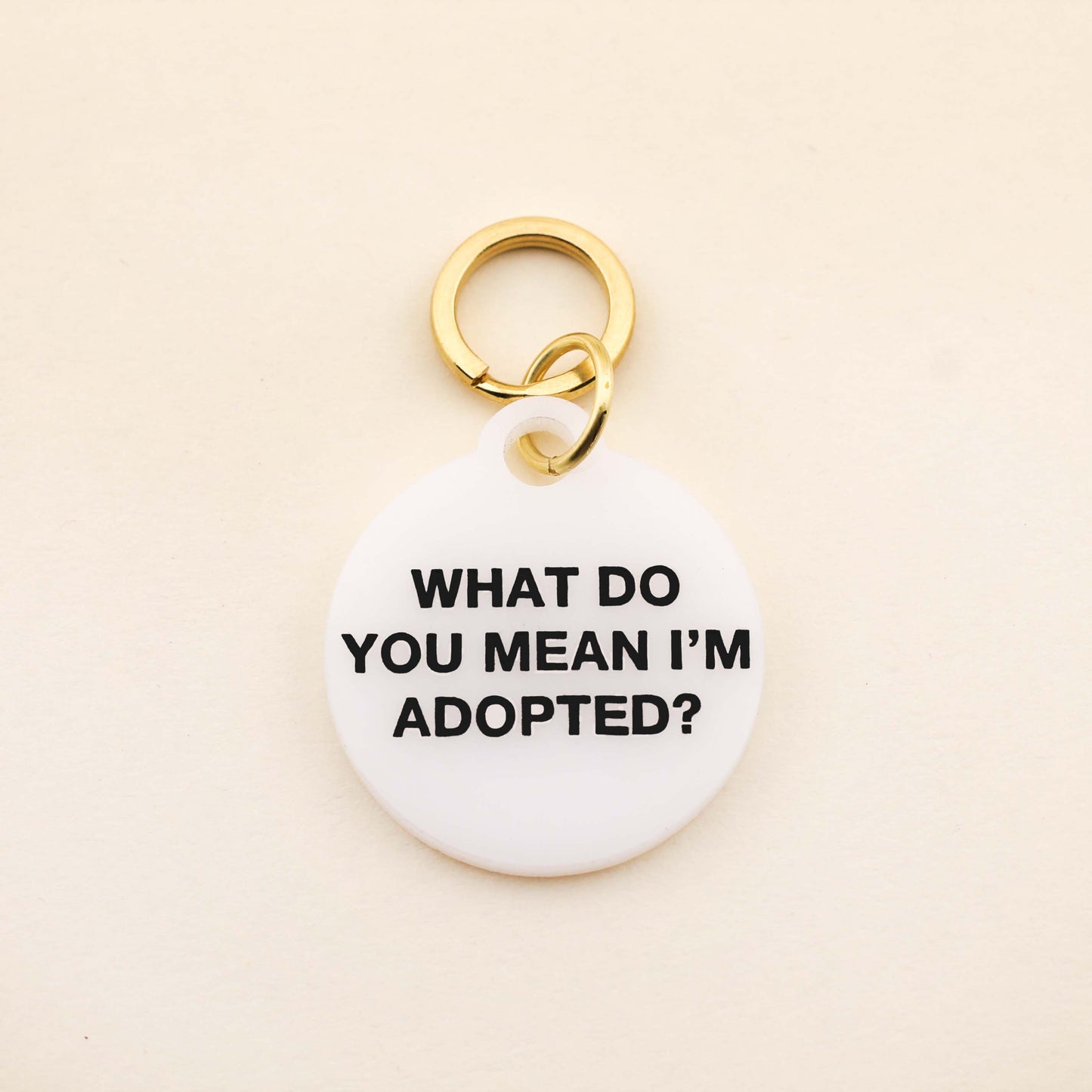 "What do you mean I'm adopted" Pet tag The perfect pet tag for the perfect rescue pets! Our Adopted Pet Tag is available in of our high-quality White Acrylic! Pet tags are sold individually Size: 1.25" L by 1.4" H Made of high-quality acrylic Handcrafted in Augusta, Georgia