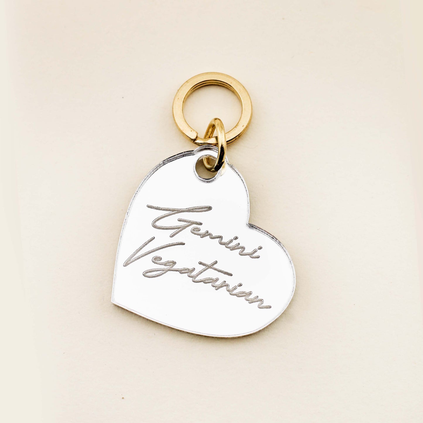 Make sure your four-legged friend has the best costume with our limited edition Bruiser Woods Pet Tag! This handcrafted dog tag is inspired by Legally Blonde and features our high-quality silver mirror acrylic that is engraved with the phrase, "I'm a Gemini Vegetarian". DETAILS: Pet tags are sold individually Size: 1.18" Diameter Made of high-quality acrylic with color-fill Handcrafted in Augusta, Georgia