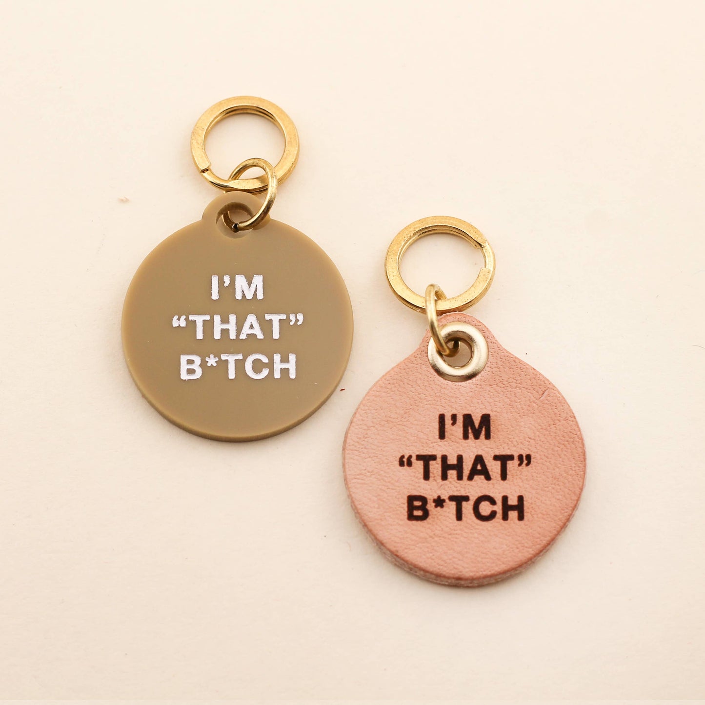 Our I'm "That" B*tch Pet Tag comes in our high-quality Tan Acrylic! Pet tags are sold individually Size: 1.25" L by 1.4" H Made of high-quality acrylic with color-fill Handcrafted in Augusta, Georgia