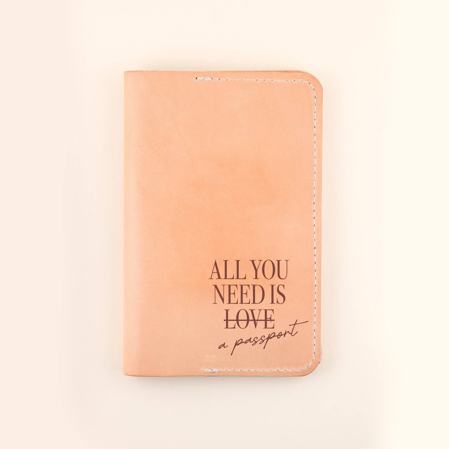Where ever you may go, take our handcrafted All You Need Passport Cover along for the journey. DETAILS: Individual Size: 6" L x 4" H Made of Top-Grain Leather with a Suede Strap Interior includes two pockets Comes packaged in a beautifully branded Freshwater box CARE INSTRUCTIONS: Wipe with a soft, dry cloth