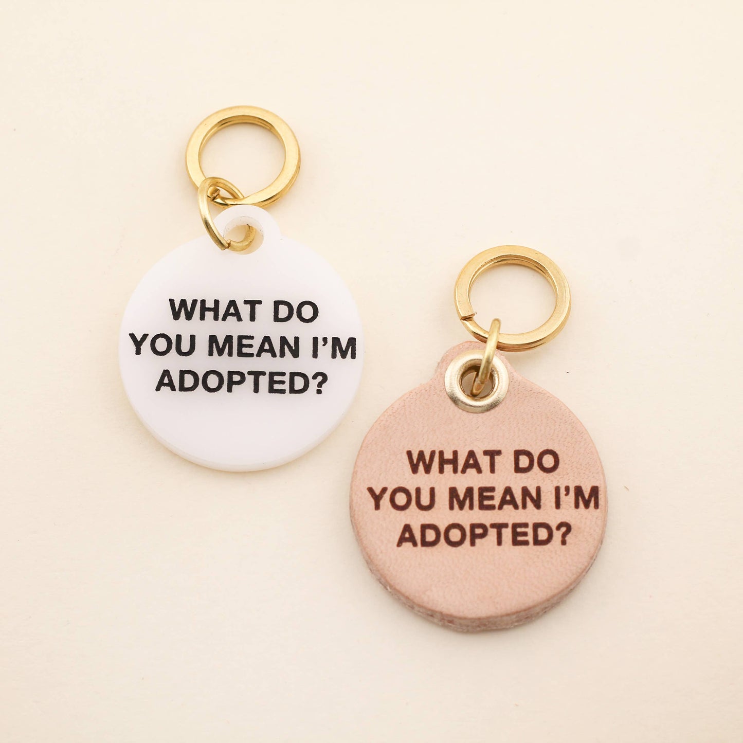 "What do you mean I'm adopted" Pet tag The perfect pet tag for the perfect rescue pets! Our Adopted Pet Tag is available in of our high-quality White Acrylic! Pet tags are sold individually Size: 1.25" L by 1.4" H Made of high-quality acrylic Handcrafted in Augusta, Georgia