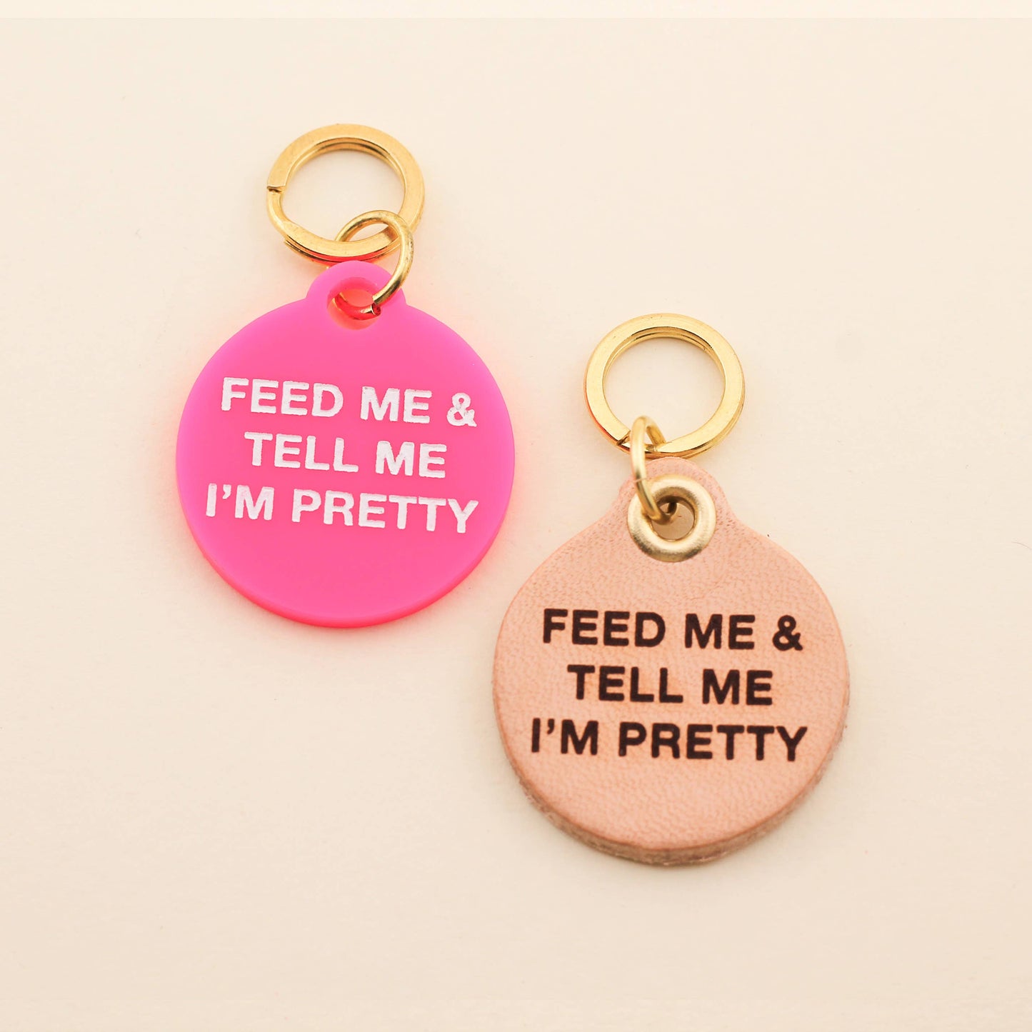 Designed for our customers who have a big obsession with their four-legged friend! Our Feed Me & Tell Me I'm Pretty Pet Tag comes in our high-quality Barbie Pink Acrylic! Pet tags are sold individually Size: 1.25" L by 1.4" H Made of high-quality acrylic with color-fill Handcrafted in Augusta, Georgia